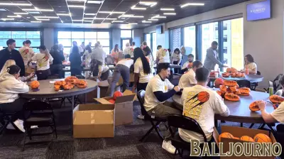 Volunteers honor local sports leader Jim Morris during March Madness preparations